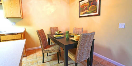 Open layout kitchen with dining room atCountryside Apartments in Poway, California