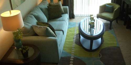 A couch, arm chair and coffee table in a model living room at Hawk's Landing in Fort Myers, Florida