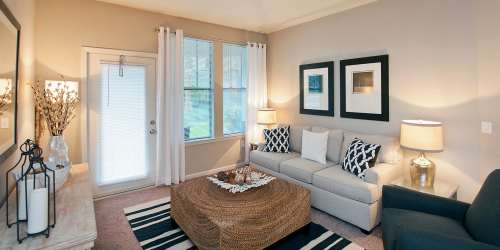 Bedroom with wall art Whitepalm Luxury Apartment Homes in Port Orange, Florida