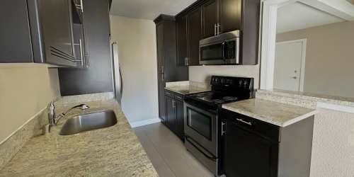 Kitchen with cabinets at Montecito Villas in Sacramento, California