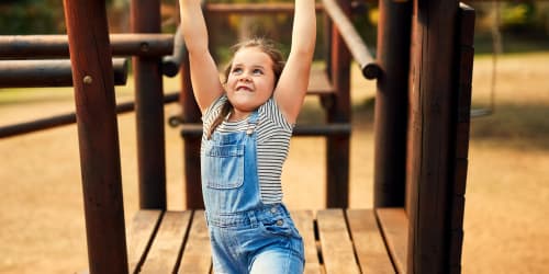 Children playing in playground near Ashgrove Farms Townhomes in Nicholasville, Kentucky