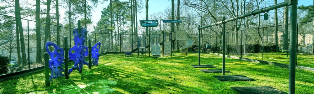 The grassy children's park at Five7Five in Austell, Georgia