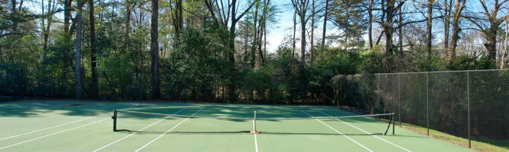 A gated tennis court at Rivers Edge Apartments in Jonesboro, Georgia