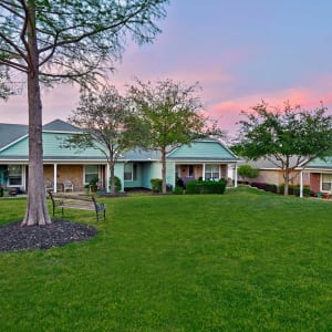 Green lawn outside of Sunstone Village at sunset in Denton, Texas