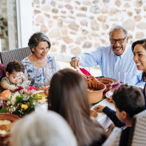 Residents enjoying a family dinner at Buffalo Run in Princeton, Texas