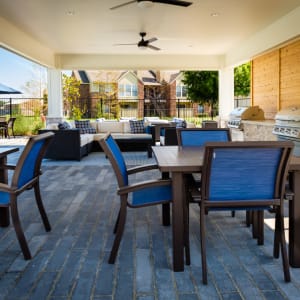 Covered patio with barbeque grill outside of Haven at Lewisville Lake in Lewisville, Texas.