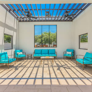 Pergola-covered outdoor lounge at The Spring at Silverton in Fort Worth, Texas.