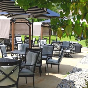 Covered patio with barbeque grill outside of Schuyler Commons in Utica, New York.