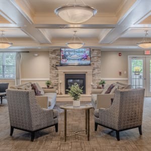  Community TV area with big fire place at Glenmont Abbey Village in Glenmont, New York