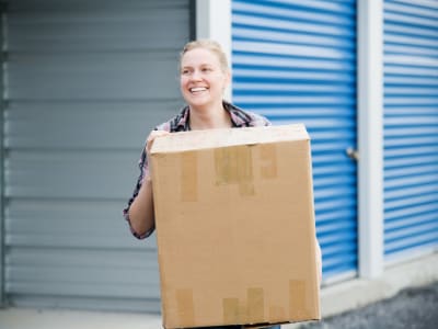 Removing a box from storage at Storage Star Pond Springs in Austin, Texas