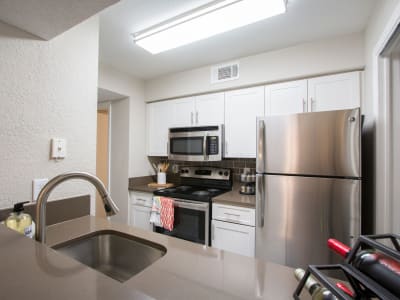 An apartment kitchen at Fairways at Feather Sound in Clearwater, FL