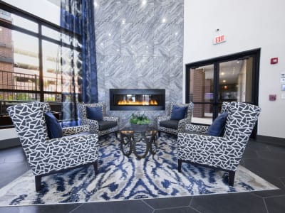  Sitting area in front of a gas fireplace in the stunning resident lounge at Steelyard in Oklahoma City, Oklahoma