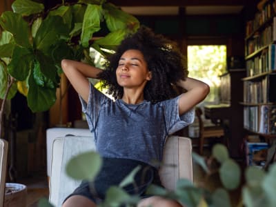 Woman relaxing at Sequoyah Apartments in Concord, California