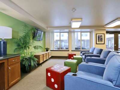 Resident lounge with coffee bar and flat screen TVs at The Blakely in Shoreline, Washington