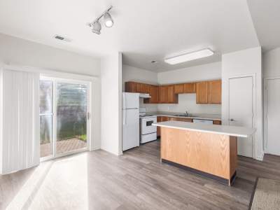 Kitchen area with an island in an apartment at Vienna Woods 