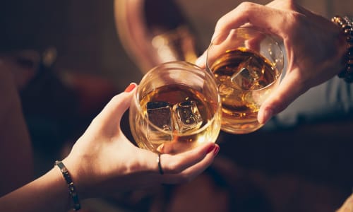 Residents sharing drinks near Amador Apartments in Hayward, California