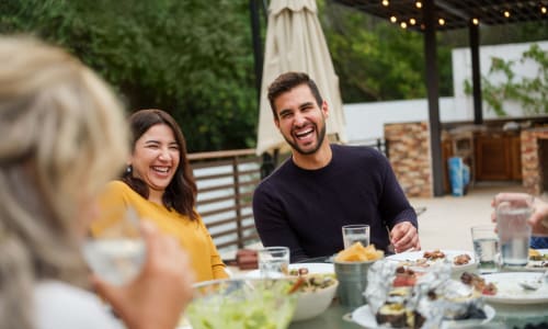 Happy family enjoying the dinner in restaurant near Creekside Park Apartments in Napa, California