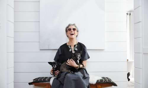 Resident and her puppies in their new apartment at Encore at West Valley in White Lake, Michigan