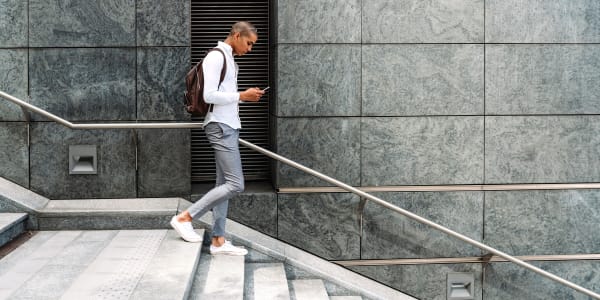 Resident walking to work in Chicago, Illinois near Residences at 8 East Huron