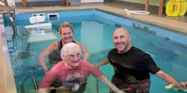 Resident in the water with a therapist at Holton Manor in Elkhorn, Wisconsin