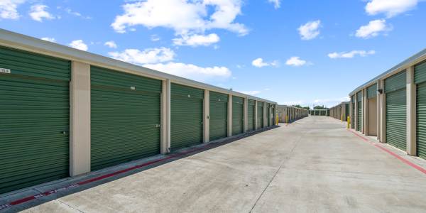 A couple packing items into their car near Storage Hub - Grissom & Tezel in San Antonio, Texas