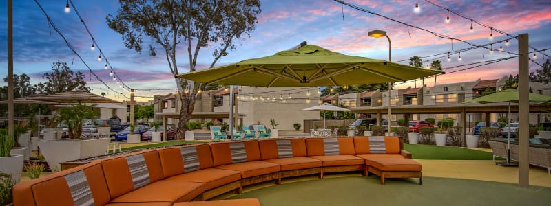 Poolside seating at Avia McCormick Ranch Apartments in Scottsdale, Arizona