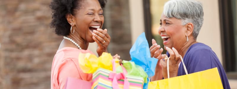 Two friends having a blast shopping at some of the cool local stores near Eastgold Long Island in Long Beach, New York