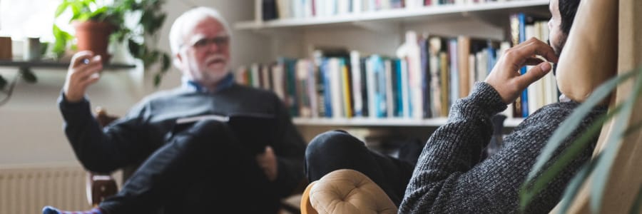 Resident talking with a therapist at a WISH community