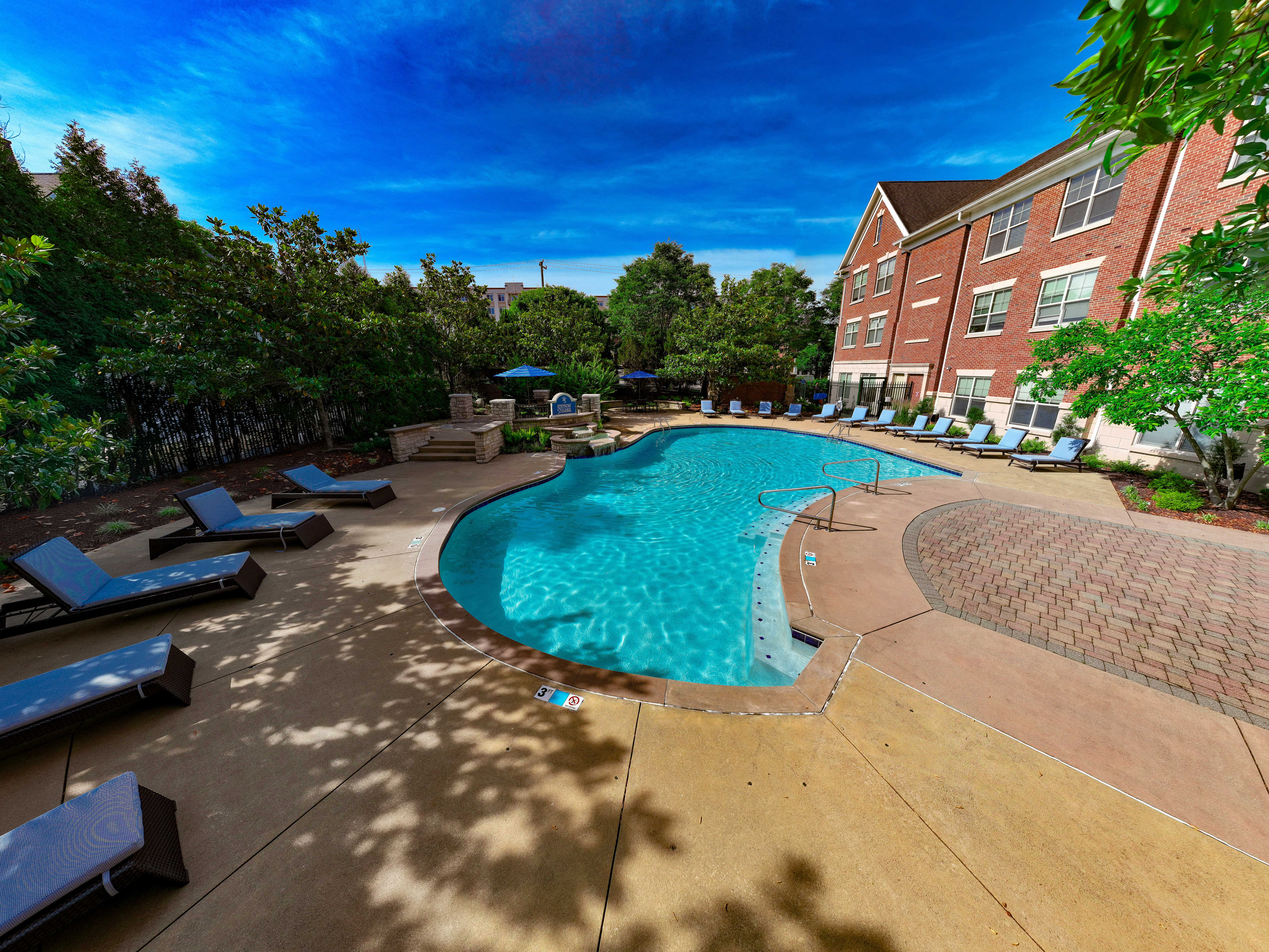 Swimming pool and lounge chairs at The Village at Stetson Square in Cincinnati, Ohio