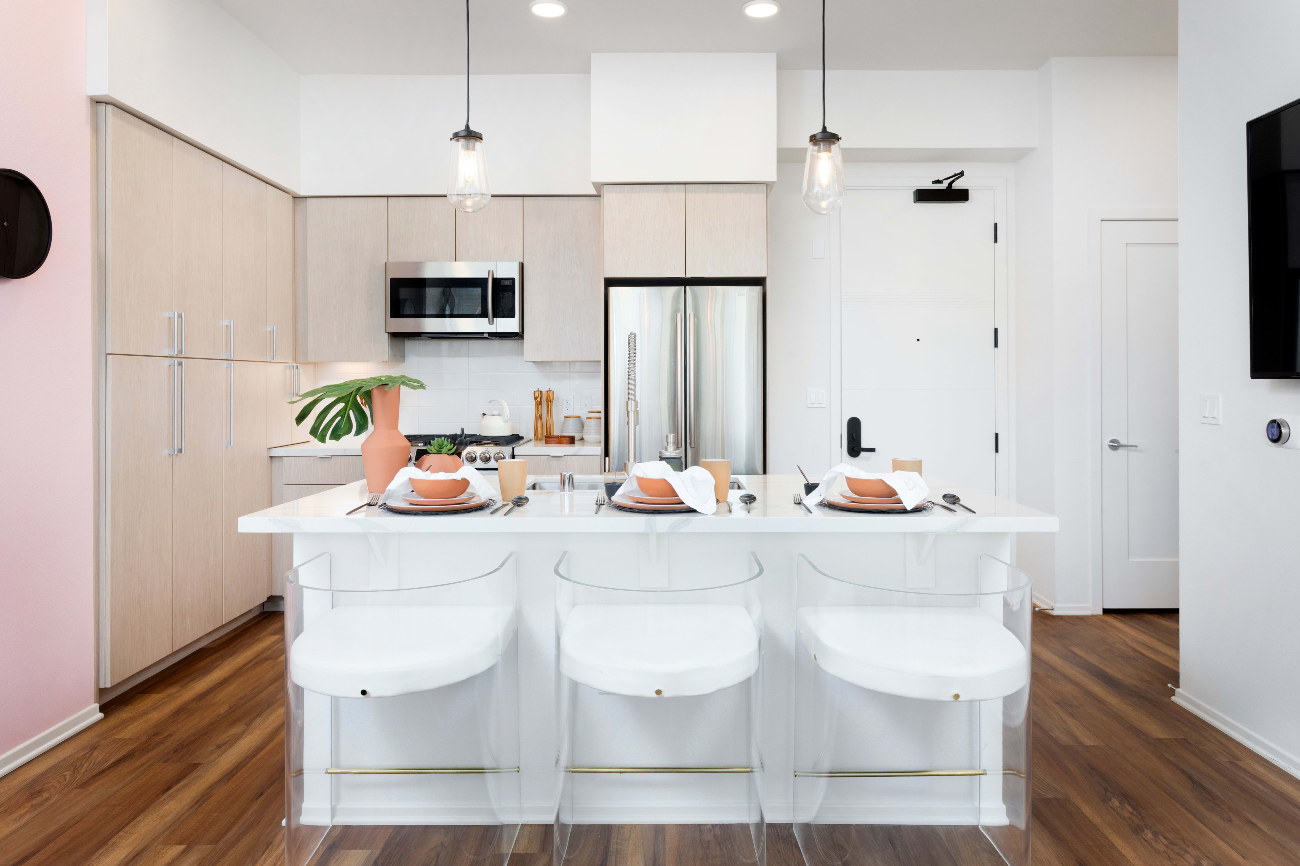 Kitchen with island in a model home at The Artisan in San Diego, California