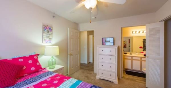 Gorgeous master bedroom with ceiling fan at Campus Crossings in Murfreesboro, Tennessee