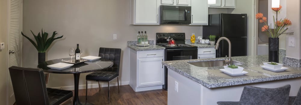A kitchen with plenty of counter space at Sommerall Station Apartments in Houston, Texas