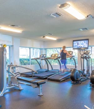 Cardio equipment in the fitness center at Fairway View in Hialeah, Florida