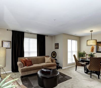 Living room with ample light at Hunter's Glen in Upper Marlboro, Maryland