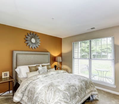 Bedroom with beautiful bed and window at Hunter's Glen in Upper Marlboro, Maryland
