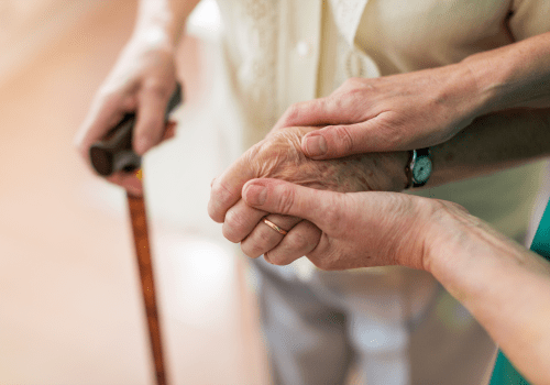 Holding hands at Methodist Homes of Alabama & Northwest Florida. 