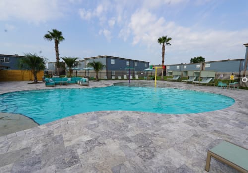 Beautiful and luxurious swimming pool at Emerald Pointe Apartment Homes in Harvey, Louisiana