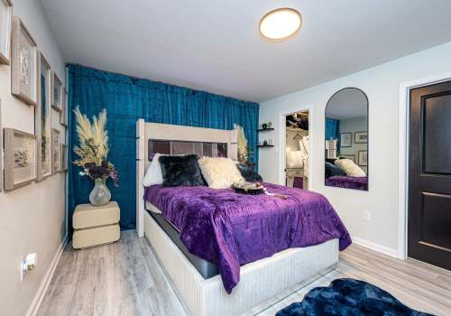 Cozy bedroom at The Mayfair Apartment Homes in New Orleans LA