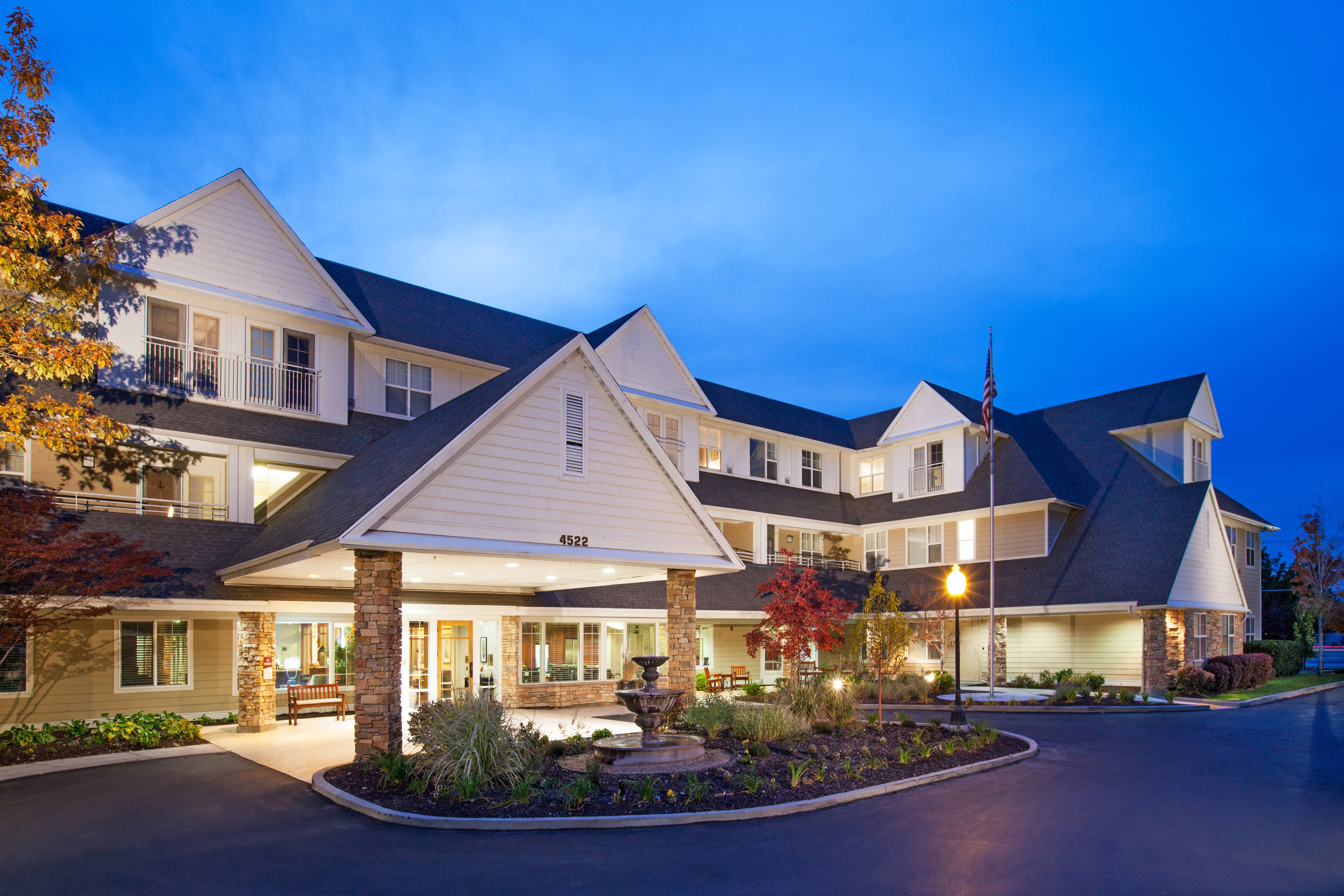 Senior laughing with caregiver at The Wellington in Salt Lake City, Utah