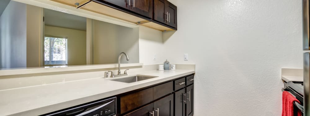 A modern apartment kitchen at Serramonte Ridge Apartment Homes in Daly City, California