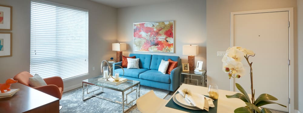 A stylishly-furnished living room at Strata Apartments in Denver, Colorado