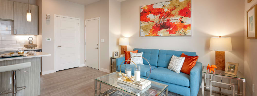 A stylishly-furnished living room at Strata Apartments in Denver, Colorado