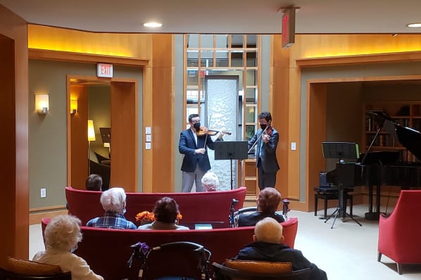 Dueling Violin Concert In the Grand Living Room at All Seasons Rochester Hills in Rochester Hills, Michigan
