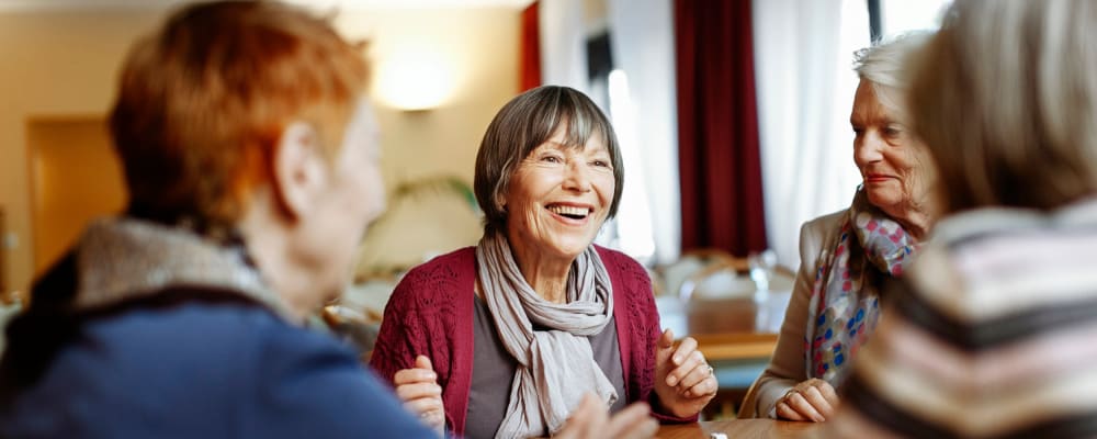 Three smiling residents The Peaks at South Jordan Memory Care in South Jordan, Utah