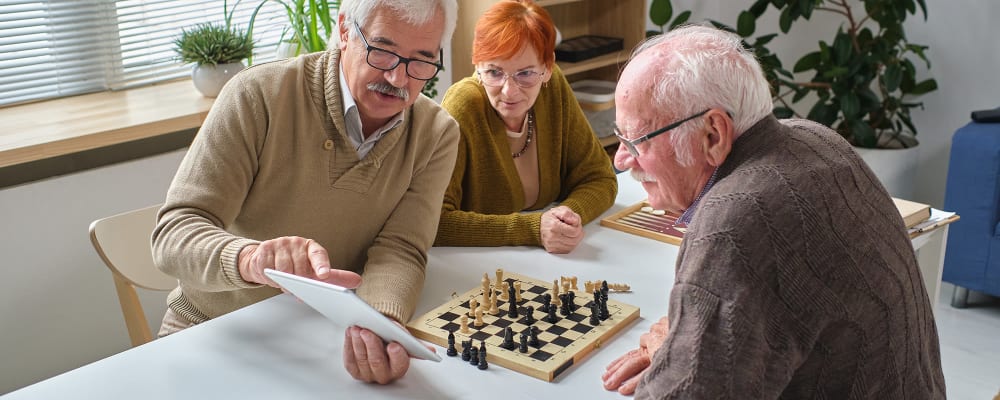 Residents talking over a game of chess at Vista Prairie at Copperleaf in Willmar, Minnesota