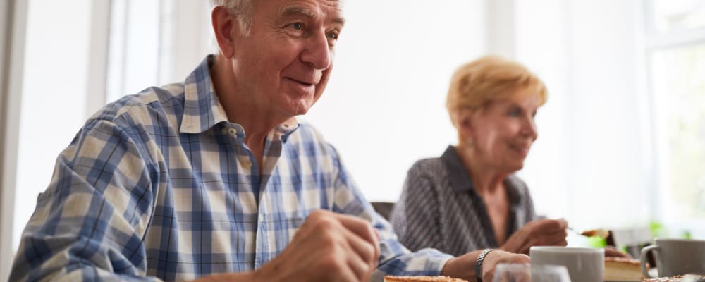 A resident smiling at a staff member at The Ridge at Lansing in Lansing, Michigan