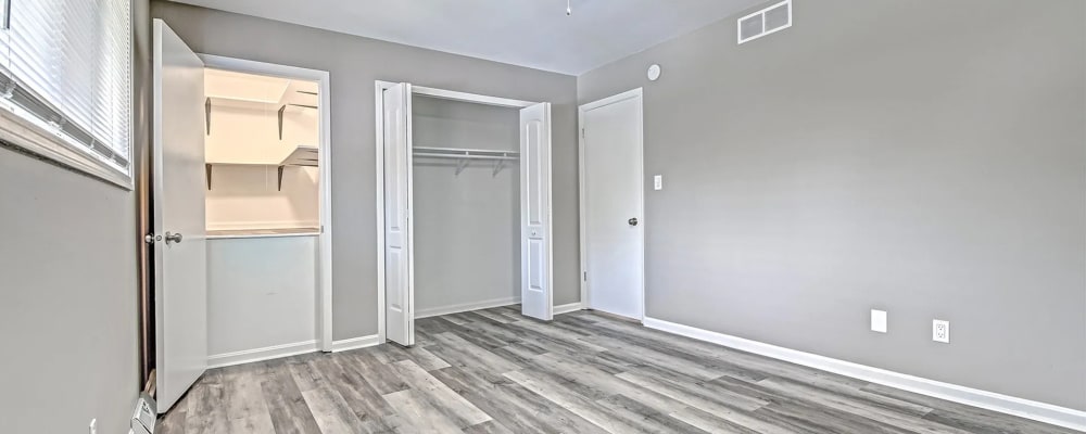 Well-lit bedroom with a walk-in closet at Woodside Village in Valparaiso, Indiana