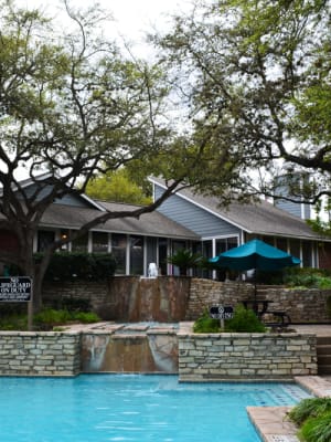 Swimming pool with cascading waterfalls at The Abbey at Medical Center in San Antonio, Texas