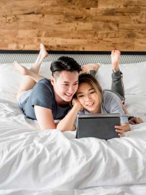 Residents on their bed at The Abbey at Energy Corridor in Houston, Texas