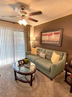Living room with sofa and coffee table at The Abbey at Hightower